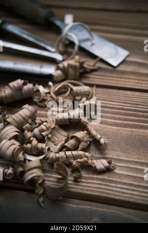 Top view layout of a set of wood chisels for carving wood, sculpture tools on wooden background Stock Photo
