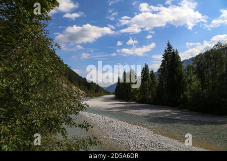 Mountain landscape with a small river in the Alps. Stock Photo