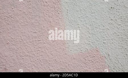 Two colored painted wall surface in shades of pink and white gray. Grunge textured background with copy space Stock Photo