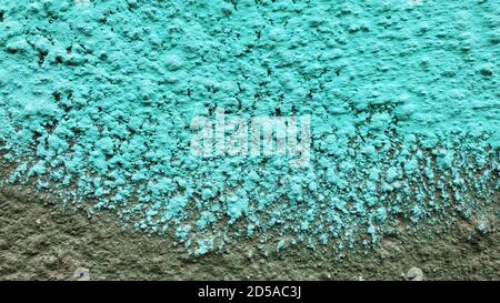 Turquoise blue painted wall surface closeup. Grunge texture background with spotted pattern and copy space Stock Photo