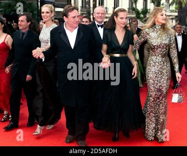 British director Roland Joffe (L) arrives with several cast members from his film  'Vatel' which makes its world premiere at the opening of the 53rd Cannes Film Festival May 10. With Joffe are from L-R: American actress Uma Thurman, French actor Gerard Depardieu, French actresses Carole Bouquet and Arielle Dombasle. Joffe's movie is shown out of competition at the annual film jamboree on the French Riviera.
