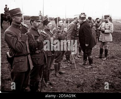 An archive picture shows French General Joseph Joffre (2nd R) congratulating and awarding medals to soldiers, who fought in the Battle of Verdun, in Verdun March 1916. A Viscount in the Armoured Cavalry Branch of the French Army left behind a collection of hundreds of glass plates taken during World War One (WWI) that have never before been published. The images, by an unknown photographer, show the daily life of soldiers in the trenches, destruction of towns and military leaders. The year 2014 marks the 100th anniversary of the start of WWI.   REUTERS/Collection Odette Carrez (FRANCE  - Tags: