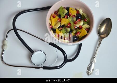 Doctor advises. Heart of vegetables and stethoscope isolated on white background Stock Photo