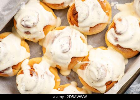 Homemade cinnamon buns with cream cheese icing. Stock Photo