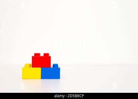 Red, yellow and blue building blocks. Isolated on white background. Stock Photo