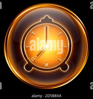 Clock icon gold, isolated on black background Stock Photo
