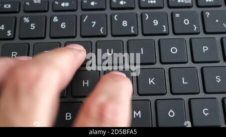 hand on keyboard, one of the most done activities in our age. Stock Photo
