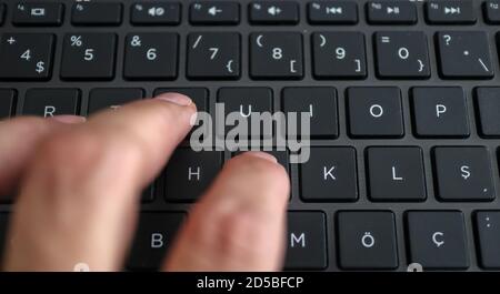 hand on keyboard, one of the most done activities in our age. Stock Photo