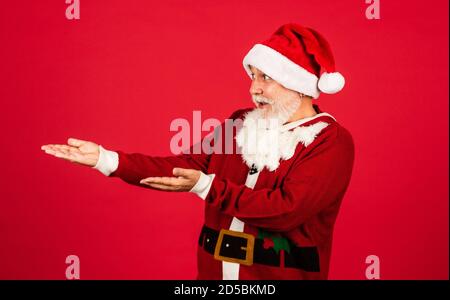 Ready for holiday. delivery new year gifts. Christmas online shopping. santa claus with white beard. man in santa hat prepare christmas present. The morning before Xmas. enjoy the winter holiday. Stock Photo