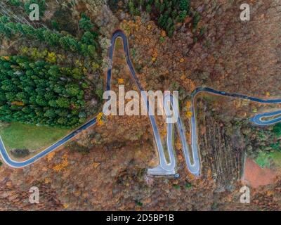 Seasons Concept winter or fall Aerial view of Winding road serpentine from a high mountain pass in the mosel village Brodenbach Germany Stock Photo