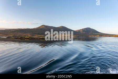 Early morning light on the hills surrounding Lochmaddy on the Isle of North Uist Stock Photo
