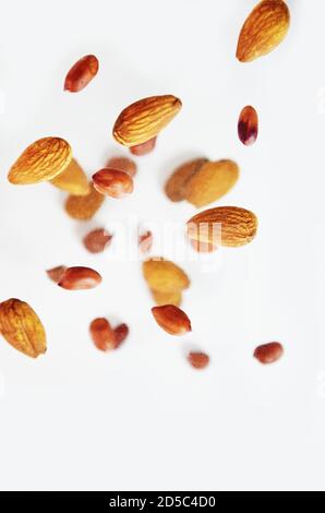 Nuts in the air on a white background, flying nuts. Healthy Brain Food, Diet, Protein, Almonds, walnuts and hazelnuts peanut Stock Photo