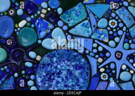 decorative blue turquoise green yellow orange mosaic tiles stones making pattern texture stars rounds for decoration illustration sea ocean Stock Photo