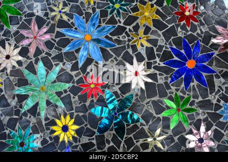 Mosaic flower decoration with shiny colorful colourful pebbles stones Stock Photo