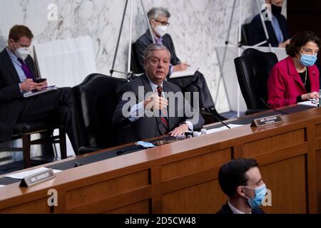 Washington, Dc, USA. 13th Oct, 2020. Committee Chairman Senator Lindsey Graham (R-SC) asks Judge Amy Coney Barrett, who has been nominated by US President Donald Trump to fill Ruth Bader Ginsburg's seat on the US Supreme Court, questions during her confirmation hearing before the Senate Judiciary Committee confirmation hearing on Capitol Hill October 13, 2020, in Washington, DC. (Photo by Brendan Smialowski/Pool/Sipa USA) Credit: Sipa USA/Alamy Live News Stock Photo