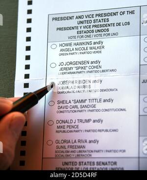 An early voter marks her ballot to vote for former Vice President Joe Biden in the 2020 U.S. presidential election. Stock Photo