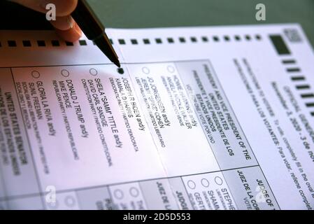 An early voter marks her ballot to vote for former Vice President Joe Biden in the 2020 U.S. presidential election. Stock Photo