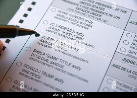 An early voter marks her ballot to vote for former Vice President Joe Biden in the 2020 U.S. presidential election. Stock Photo