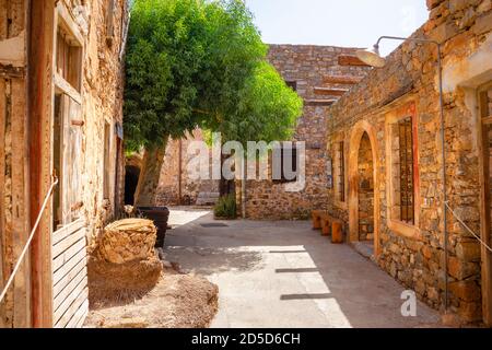 View of the island of Spinalonga with calm sea. Here were isolated lepers, humans with the Hansen's desease, gulf of Elounda, Crete, Greece. Stock Photo