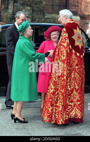 The Queen (L) is greeted by the Dean of Windsor, as she arrives with the Queen Mother for the Confirmation of her grandson, Prince William, at St George's Chapel in Windsor March 9. The service marked Prince William's full membership of the Anglican Church which one day he will head as Supreme Governor.  BRITAIN ROYALS