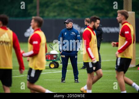 Berlin, Germany. 13th Oct, 2020. Urs Fischer (M), coach at 1 FC Union Berlin, is standing on the training pitch. Credit: Christophe Gateau/dpa/Alamy Live News Stock Photo