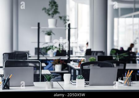 Office interior with white columns and panoramic windows in modern loft Stock Photo