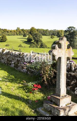 The view of the countryside from the churchyard of St Mary's church in the Cotswold village of Temple Guiting, Gloucestershire UK