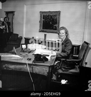Margaret Thatcher MP, Secretary State for Education and Science at her desk in the Ministry in 1970, serving in the Cabinet if the Conservative Government under Edward Heath. Mrs Thatcher went on to be elected as the first British woman Prime Minister, was dubbed the Iron Lady by the Russians and her policies became known as Thatcherism. Stock Photo