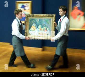 Porters make their way through Christie's auction house, June 23, carrying 'Still Life with Fruit and a Pot of Ginger' by Paul Cezanne. The painting dating from circa 1895 is expected to fetch close to 12 million pounds (US$19 milion) when it is auctioned as part of the Impressionist and Post Impressionist Art sale in London on June 28.