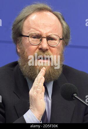 German Parliamentary President Wolfgang Thierse Holds A Pocket Edition Of The German Constitution After Addressing A News Conference In Berlin February 15 The German Parliament Said That Helmut Kohl S Christian Democratic Party