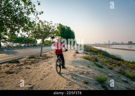 Bicyclist morning ride in Al khobar corniche -Saudi Arabia. Stock Photo