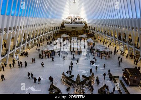 New York / USA - November 26th 2019: People in The Oculus transportation hub at World Trade Center NYC Subway Station. The interior of the Oculus duri Stock Photo