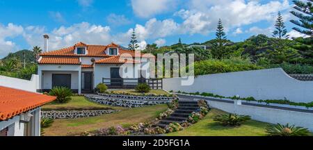 SAO MIGUEL, PORTUGAL JULY 18. 2020: Beautiful fenced luxury house with garden, on the Sao Miguel island, Azores, Portugal. Authentic Portugal house. Stock Photo