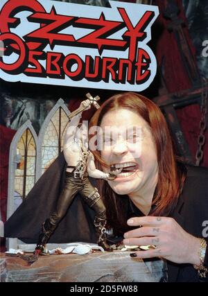 Rock Legend Ozzy Osbourne Poses For Photographers With His New Ozzy Action Figure At The Toy