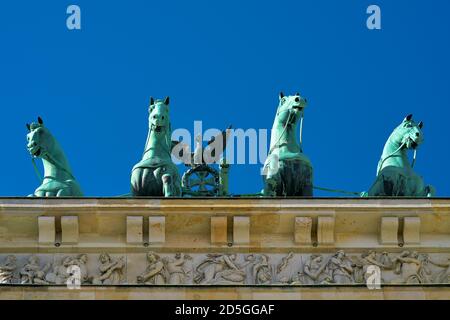 Quadriga at the Brandenburg Gate in Berlin with cloudless sky seen from below Stock Photo