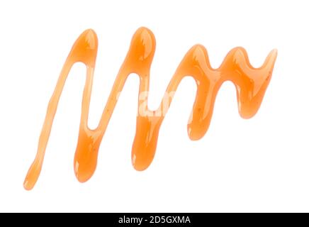 Maple syrup drizzle isolated on white background. Splashes of sweet maple syrup. Top view. Stock Photo
