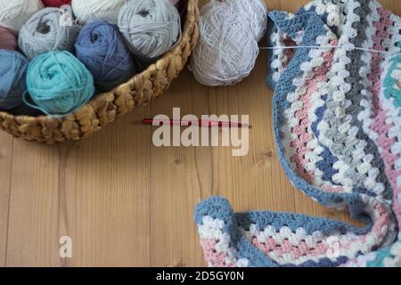 handmade blanket with wool and crochet hook Stock Photo