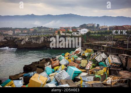 Llanes, a town on the Spanish northern coast. Colour cubes by the artist Ibarrola and the mountains of Picos de Europa in the background. Asturias. Stock Photo