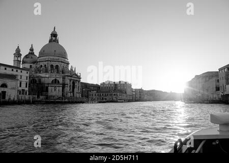 Black and white view of the Basilica di Santa Maria della Salute viewed from the Grand Canal in late afternoon Stock Photo