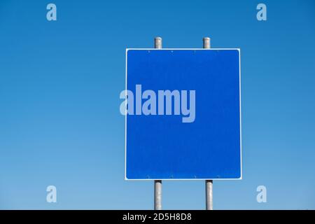 Blank road sign on two metal poles, clear blue sky background. Information sign template, copy space Stock Photo