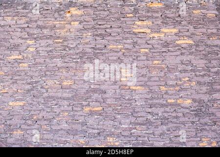 Old brown red color brick wall background and texture, closeup view. Exterior building weathered facade detail Stock Photo