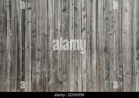 Vertical and rustic gray wood plank barn wall Quebec Canada Stock Photo