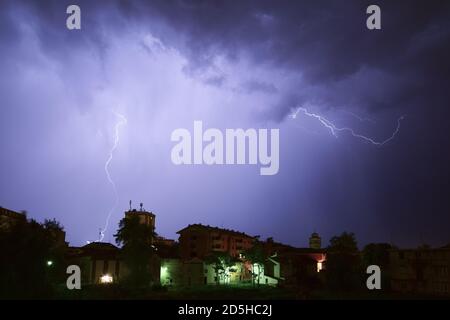lightning storm during a winter night Stock Photo