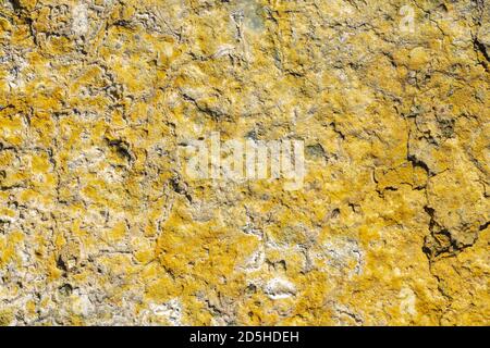 Yellow sulfur in crater of active volcano. Natural geological pattern texture, volcanic sulphur background. Stock Photo