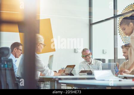 Achieving best results together. Business people having a meeting in the modern office, working together on a new project Stock Photo