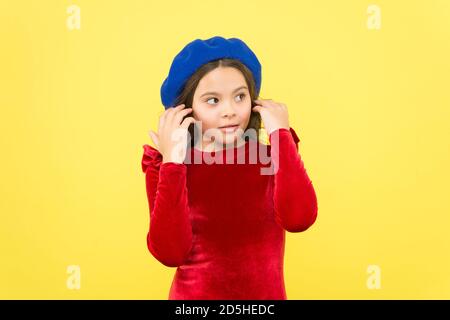 happy child wearing vintage french beret and posing for fashion shot, beauty. Stock Photo