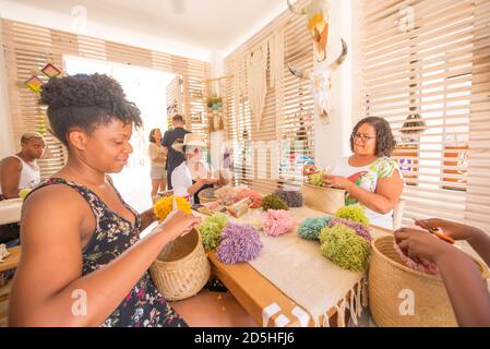 Family taking a pompom class at Evoke the Spirit in Sayulita, Mexico. Stock Photo