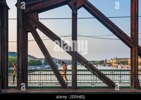 Praha: river Vltava (Moldau), railway bridge at Vysehrad, view to North, person walking in Vltava, Moldau, Praha, Prag, Prague, Czech Stock Photo