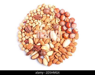 Circle made from different kinds of nuts isolated on white background. hazelnut, brazil nut, almond, pumpkin seeds, cashew.  top view. Stock Photo