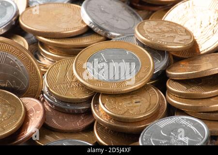 Real currency, money from Brazil. Stack with several Brazilian coins Stock Photo